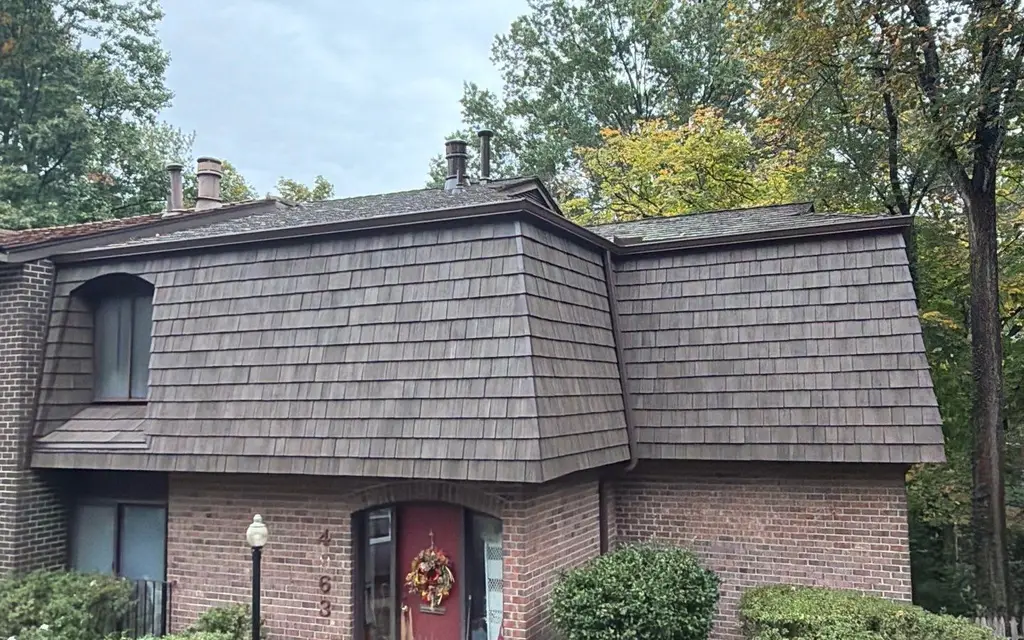 Brick home with a new Brava synthetic shake mansard roof