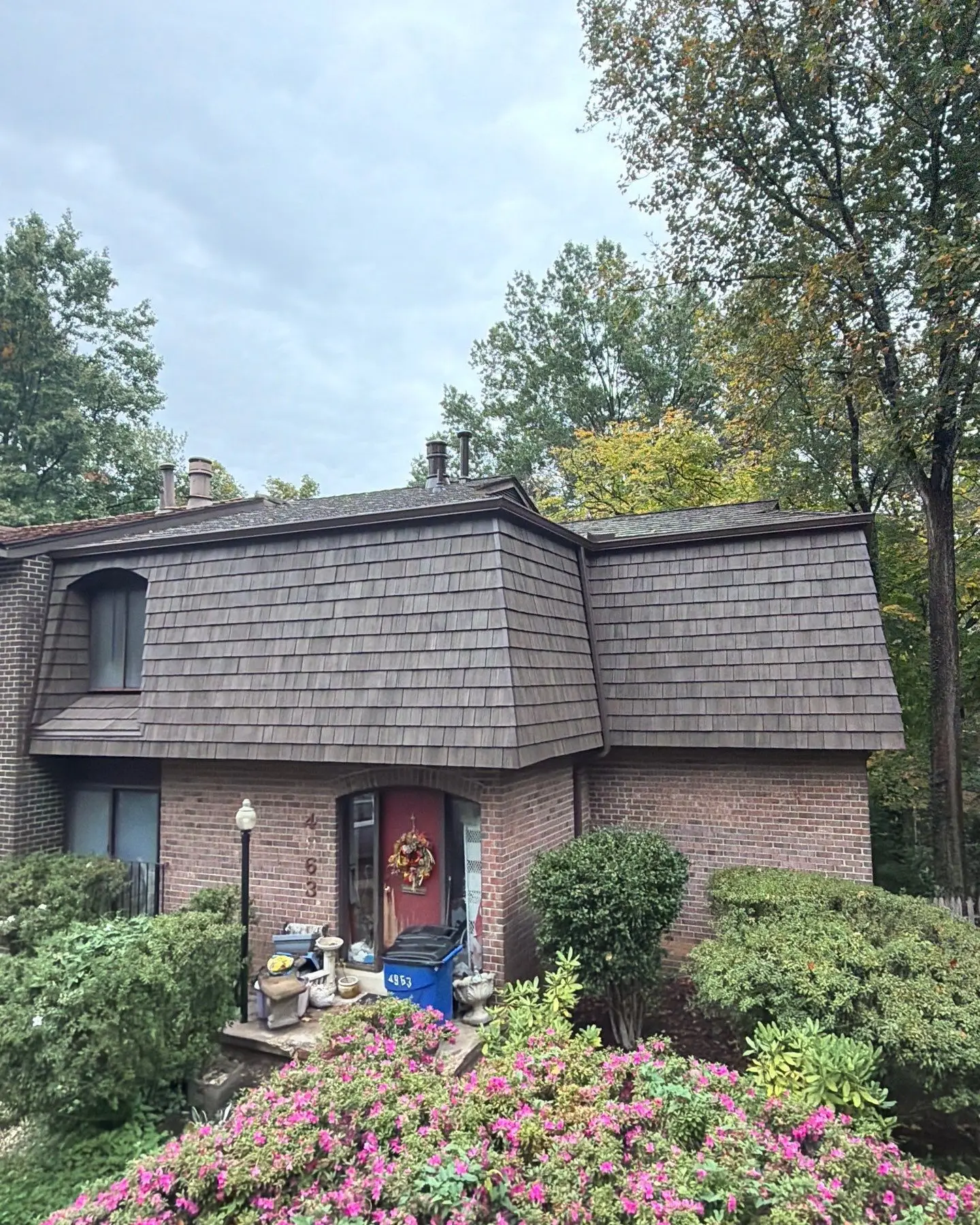 Brick home with a new Brava synthetic shake mansard roof