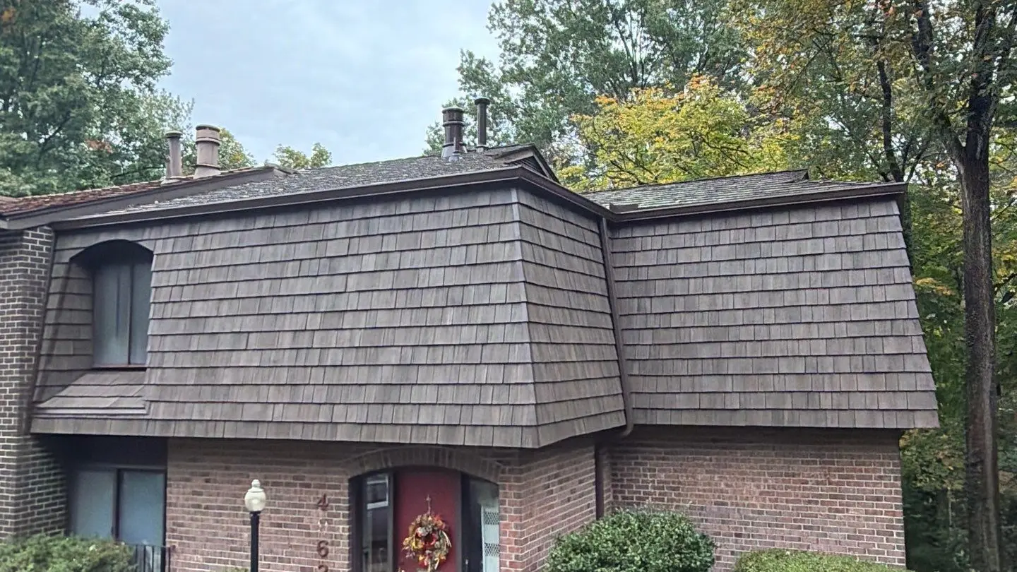 Brick home with a new Brava synthetic shake mansard roof