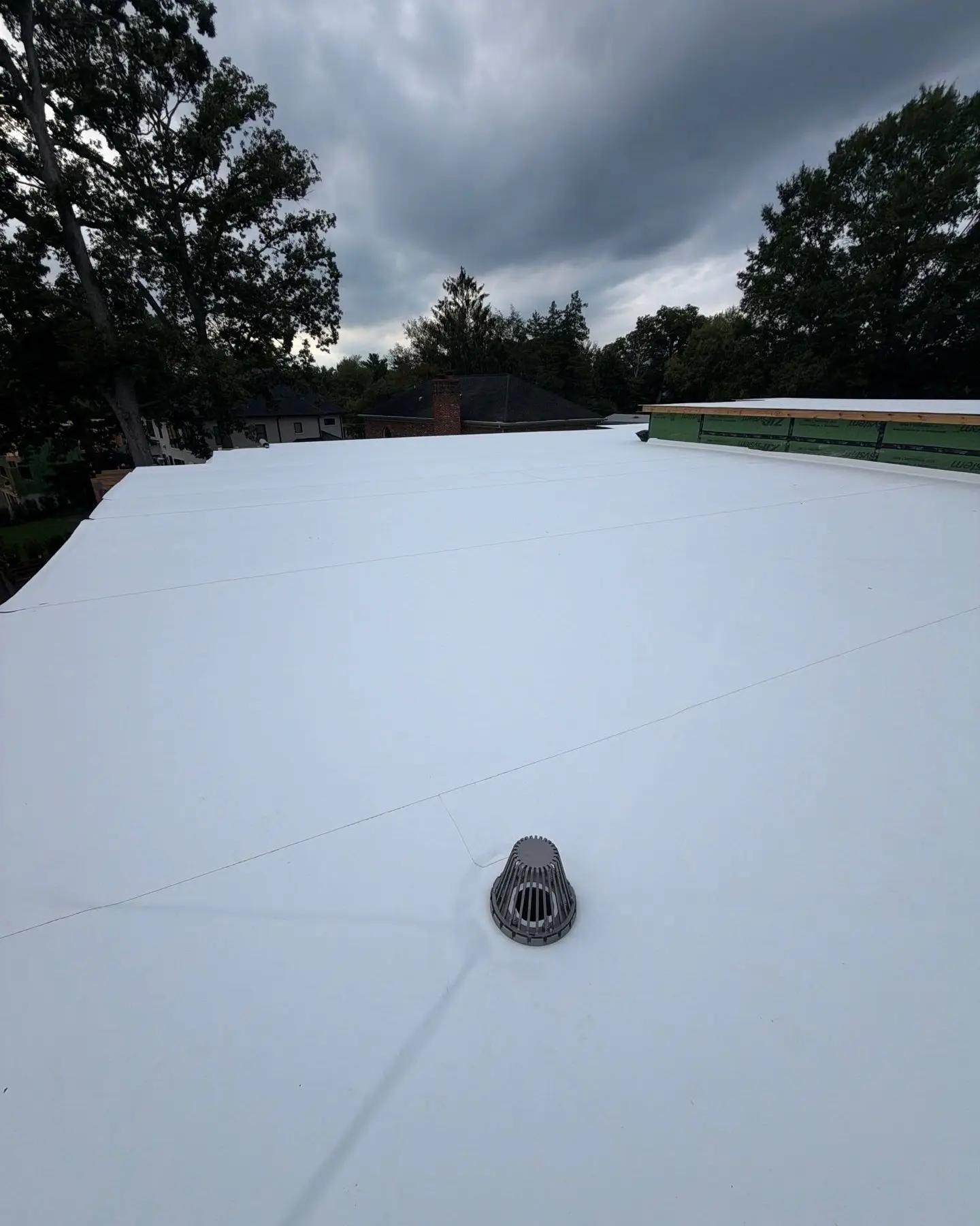White membrane flat roof installed by RC All Exteriors